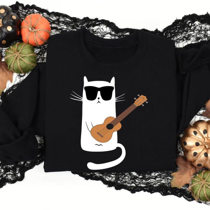 Cat Wearing Sunglasses Playing Ukulele. t-shirt
